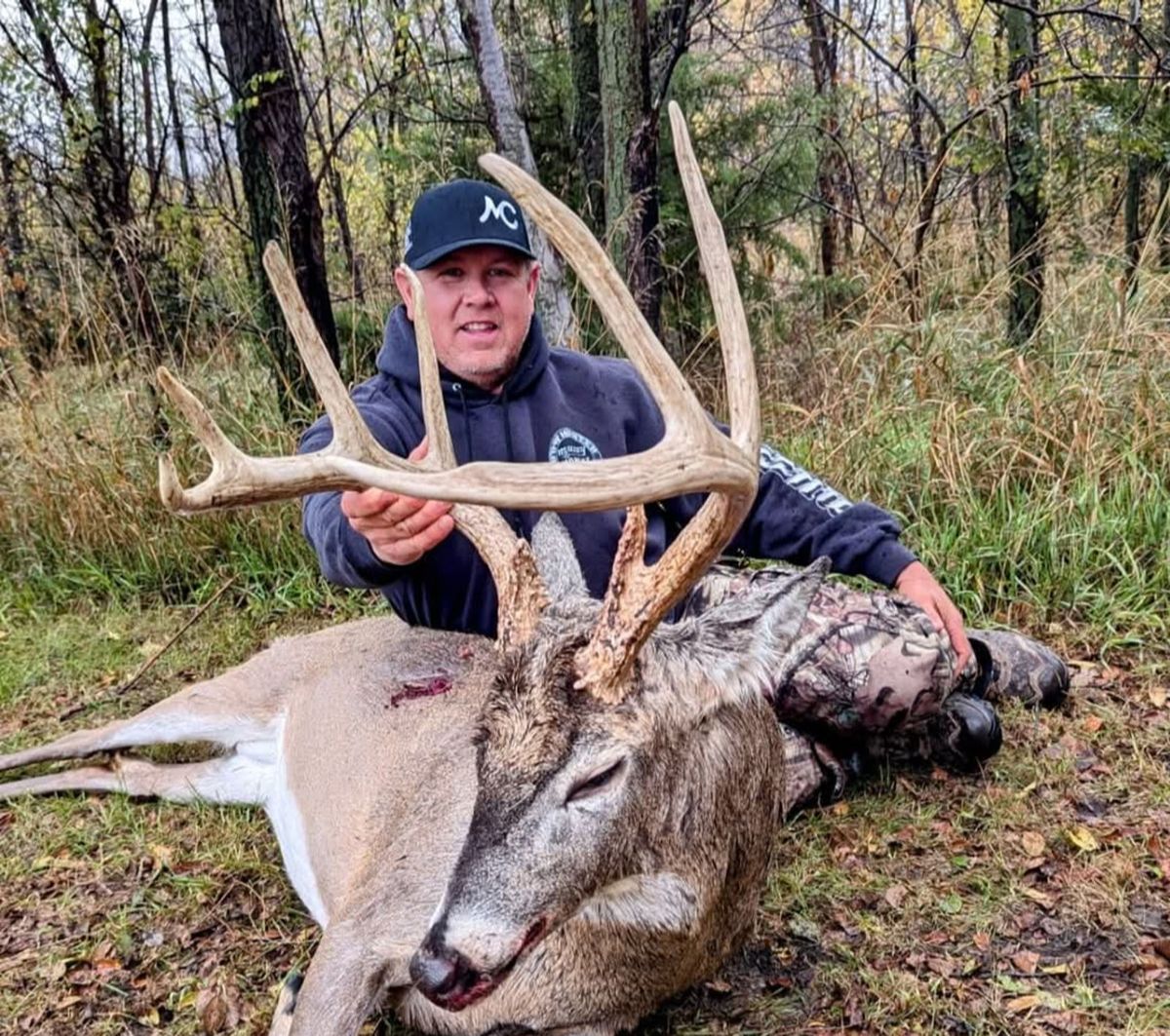 Hunters at golden hour with a Kansas buck