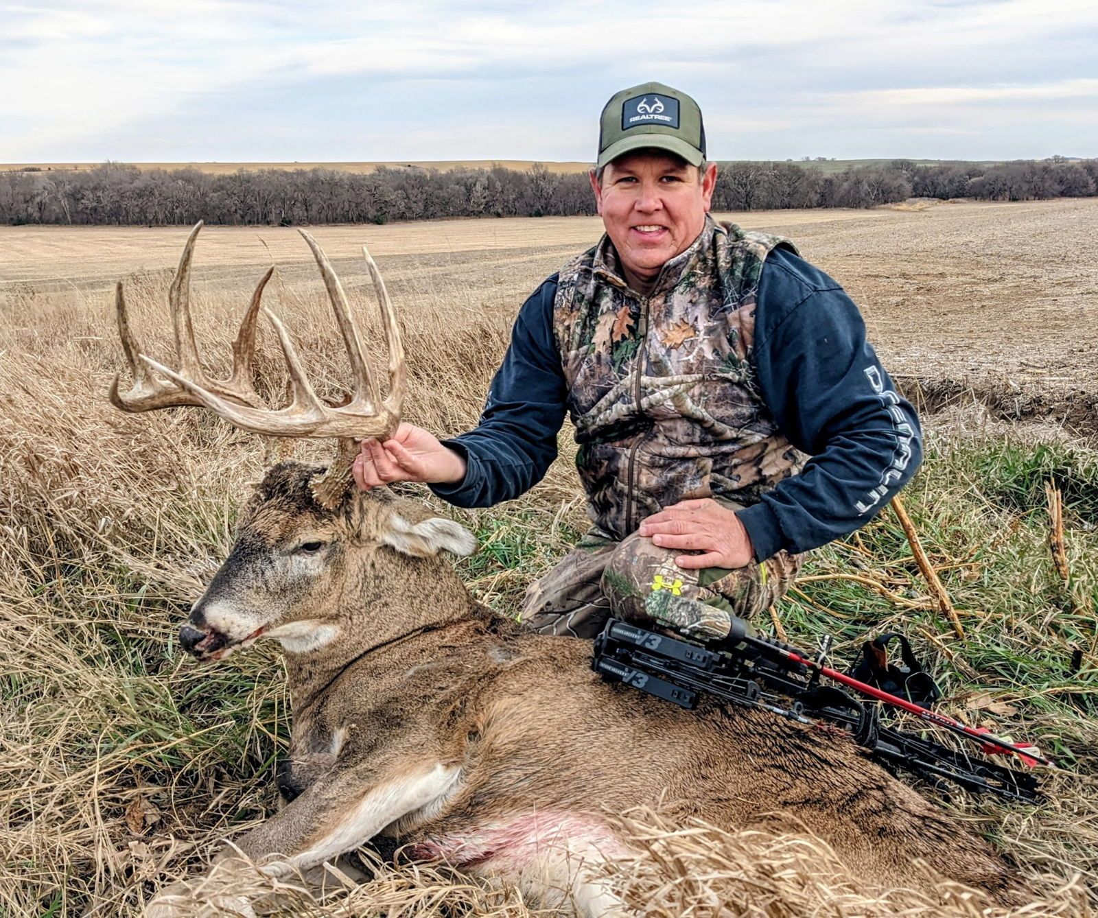 Hunter with a managed Kansas buck